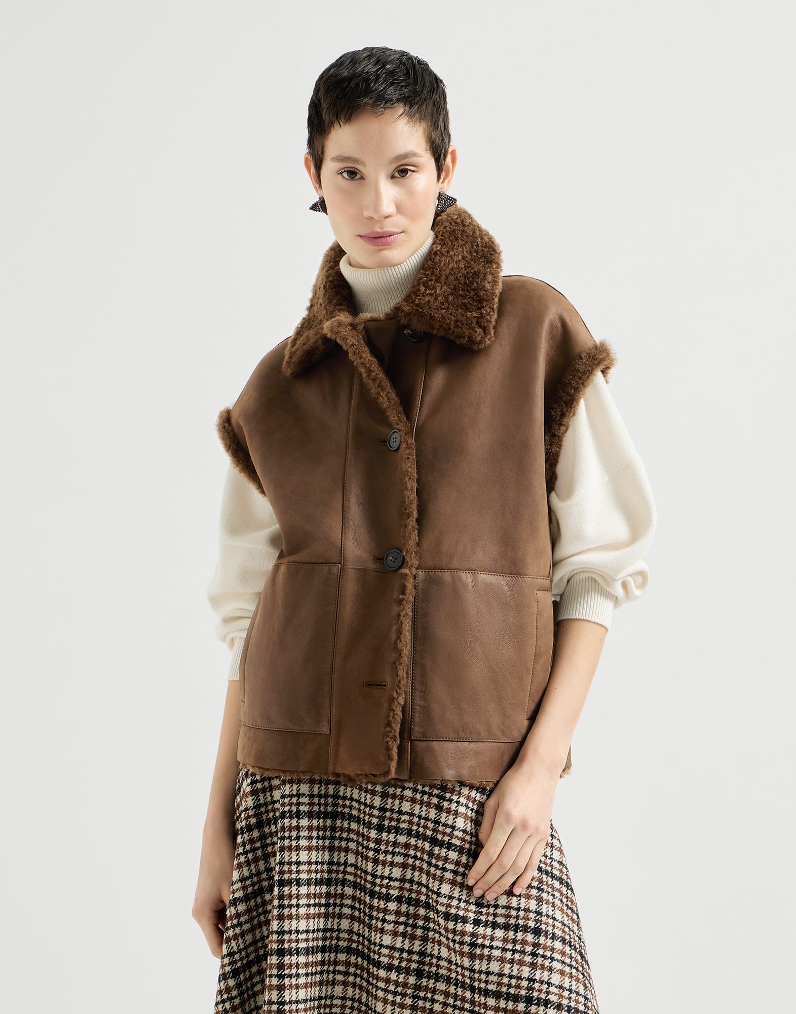 Chaleco reversible en piel de cordero Fuzzy con Monile