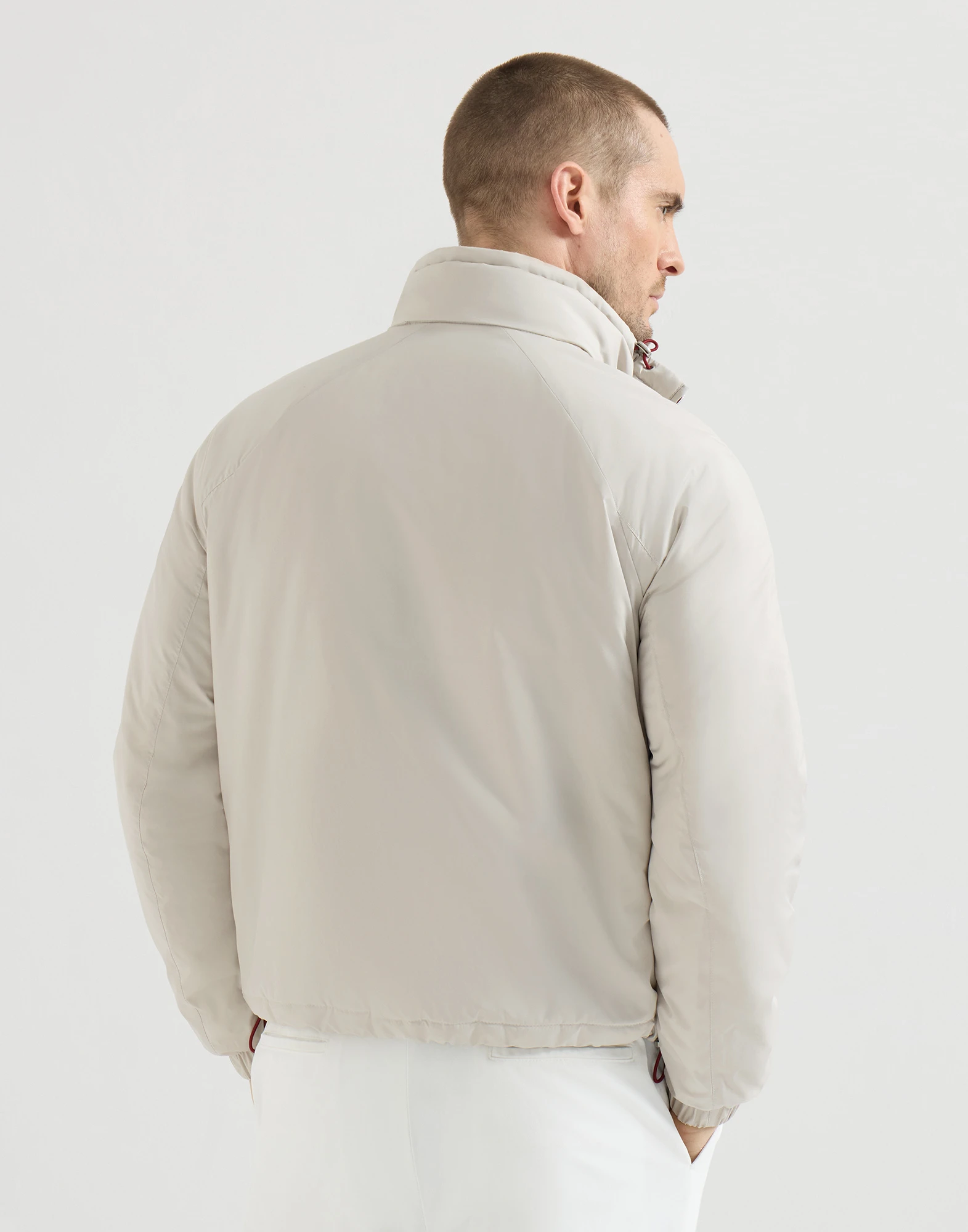 Lightweight nylon outerwear jacket with packable hood