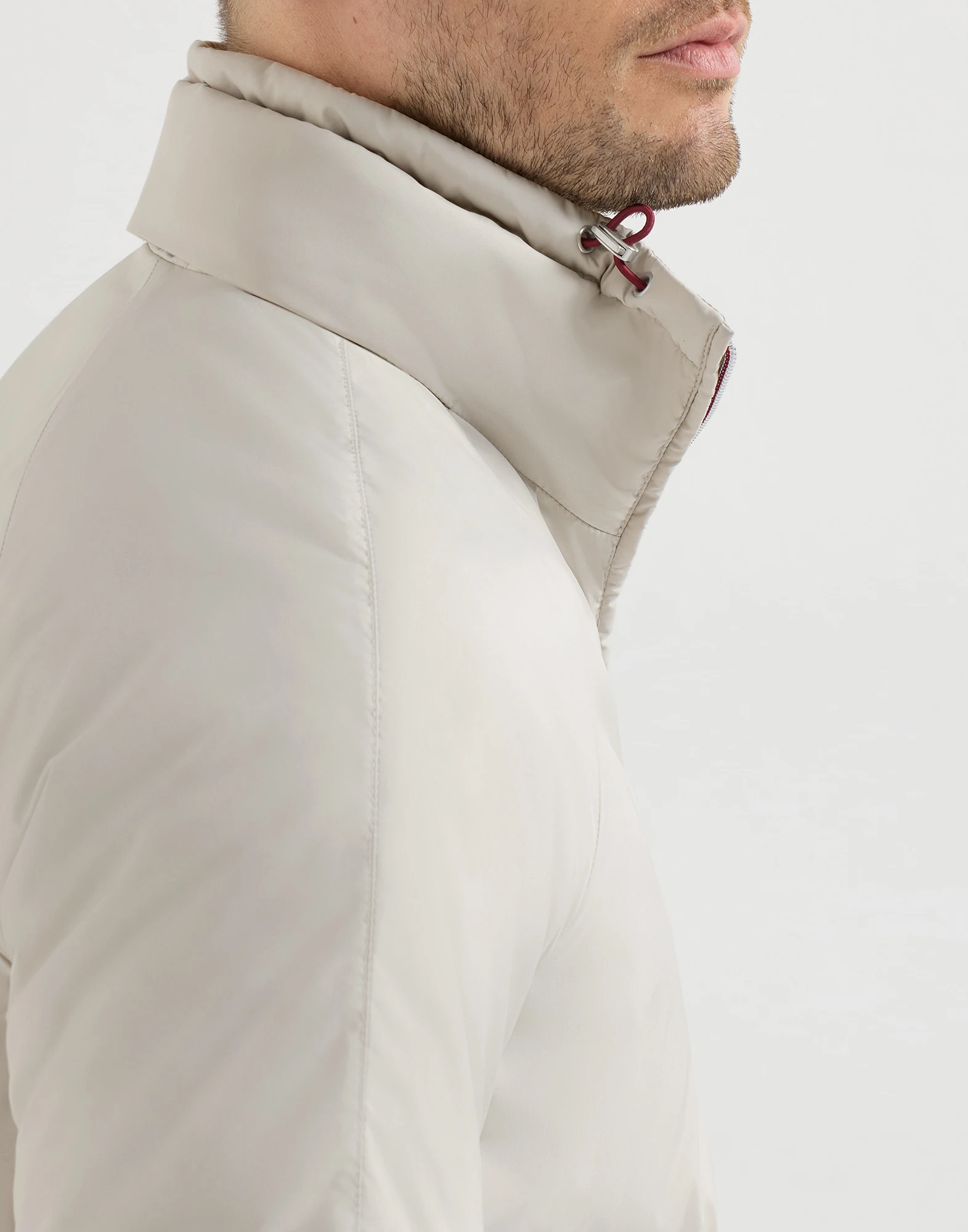 Lightweight nylon outerwear jacket with packable hood