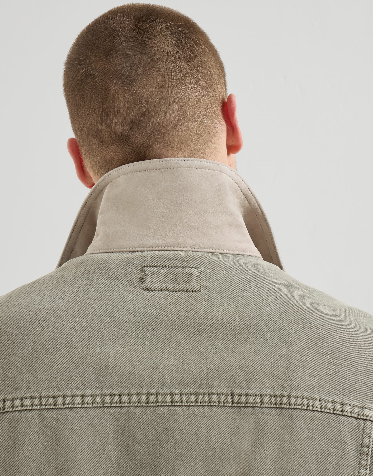 Garment-dyed outerwear jacket in denim with leather collar
